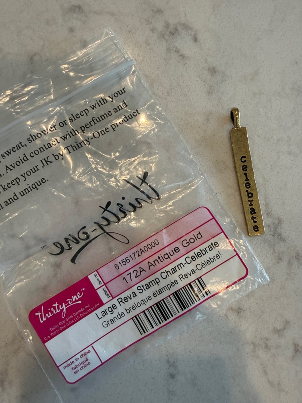 thirty-one Antique Gold Celebrate Stamp Charm